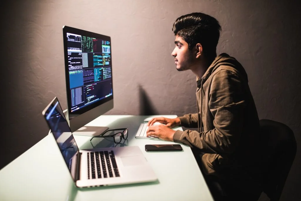 program development concept young indian man working with computer 1024x683 1 1